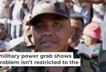 Military Col. Michael Randrianirina joins protesters as he announces that the armed forces are taking control of Madagascar on Oct. 14, 2025. AP Photo/Brian Ingang